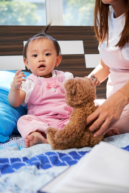 Nurse playing with baby girl