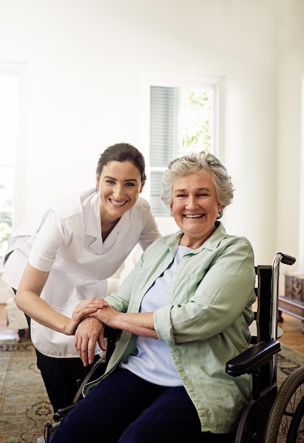 Nurse portrait and helping disabled woman in wheelchair for medical trust wellness and support in nursing home Happy senior patient and disability service for rehabilitation healthcare with mockup