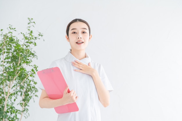 A nurse posing with peace of mind