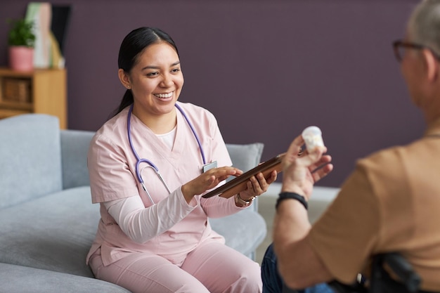 Nurse prescribing medicine to her patient