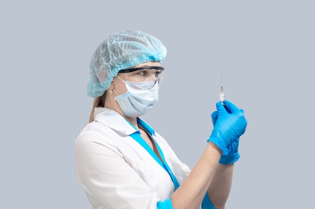 Nurse in a protective mask and glasses