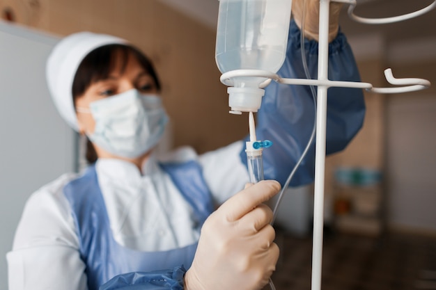 Nurse puts the counter drops in the clinic. Medical equipment in a modern hospital. Patient care