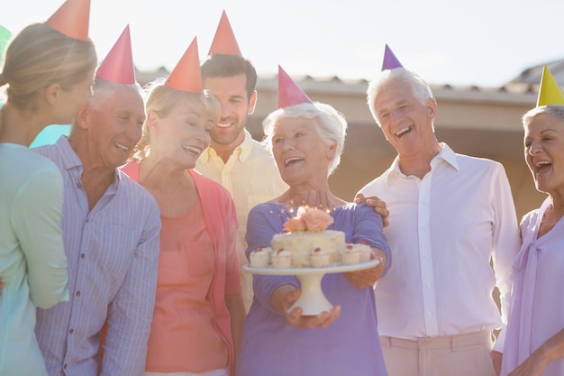 Nurse and seniors celebrating a birthday