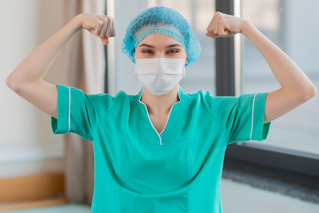 Nurse showing muscles