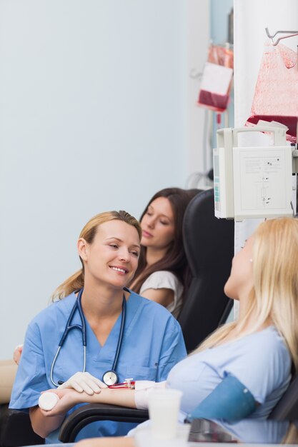 Nurse smiling to a blood donor