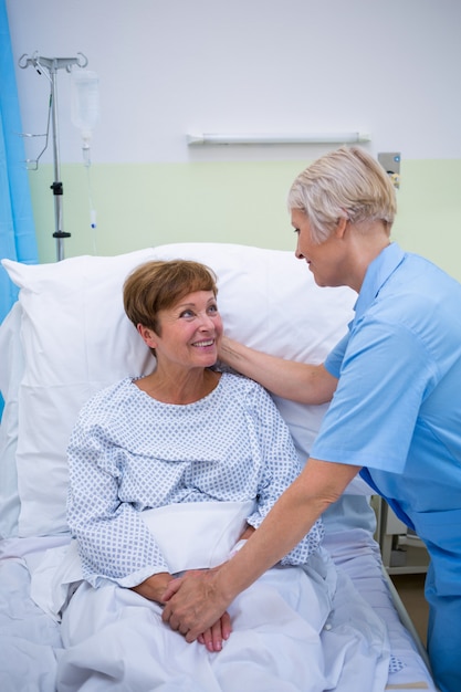 Nurse talking to a senior patient