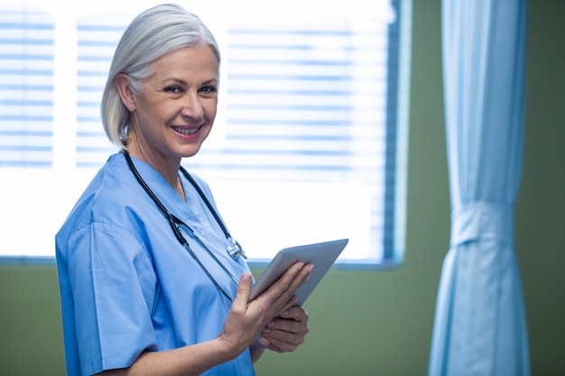 Nurse using digital tablet