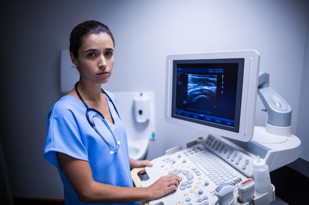 Nurse using ultrasonic monitor