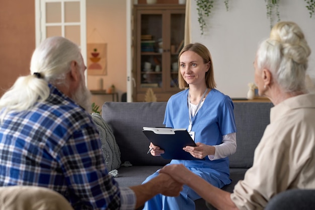 nurse visiting senior couple at home