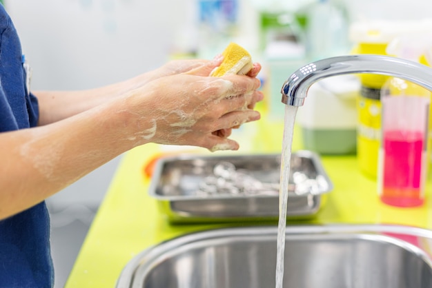 Nurse washing her hands after. Medical sanitizing procedure.