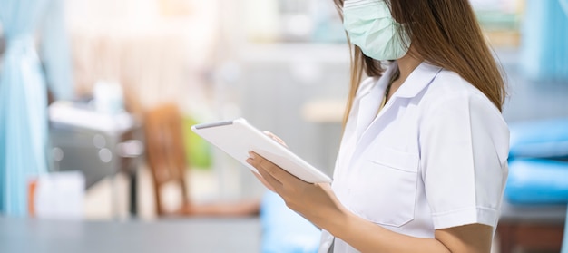 Photo nurse wearing surgical mask protection from coronavirus disease