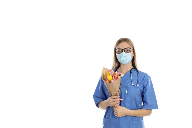 Nurse with bouquet isolated on white background