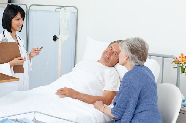 Nurse with a couple in a hospital