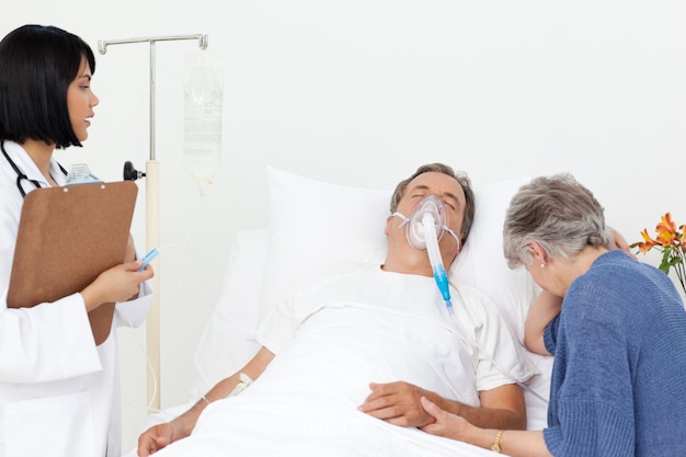 Nurse with a couple in a hospital