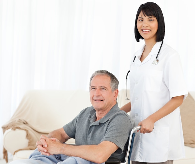 Nurse with her patient looking at the camera