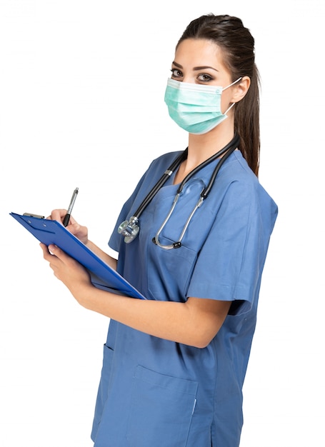 Nurse writing a document, isolated on white