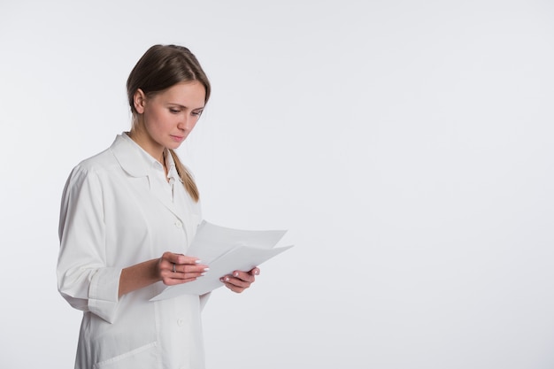 Nurse or young doctor standing isolated