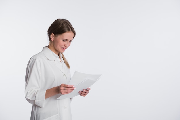 Nurse or young doctor standing isolated