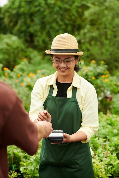 Nursery Worker Accepting Payment