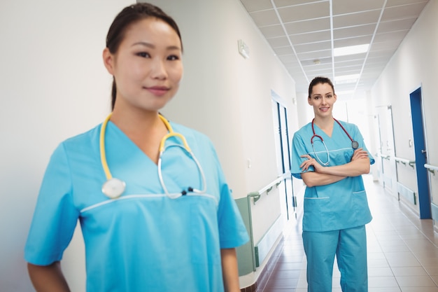 Nurses standing in hospital corridor