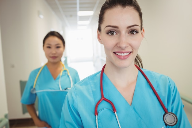 Nurses standing in hospital corridor