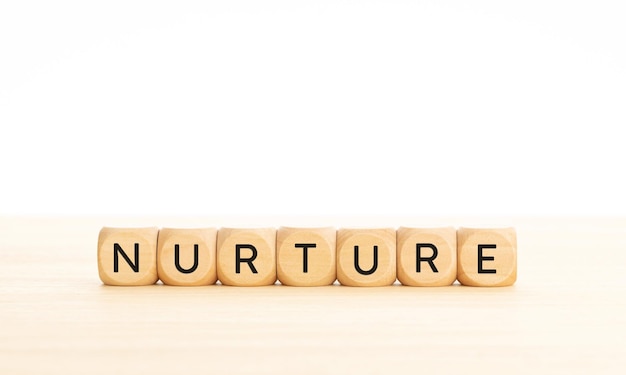 Nurture word on wooden blocks Copy space