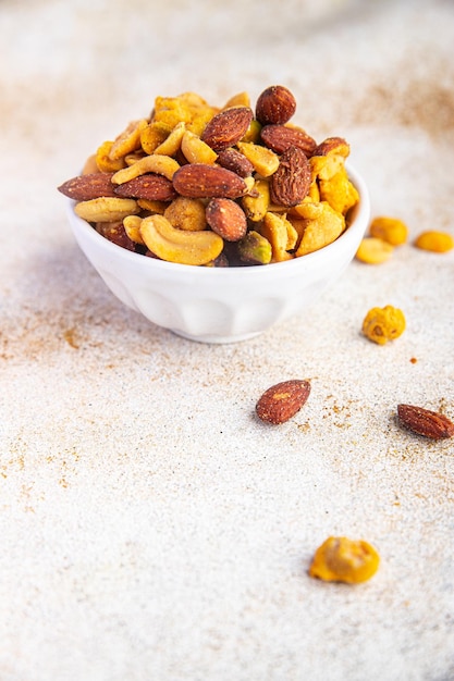nut salt snack mix almond, cashew, pistachio, peanut fresh nuts food on the table copy space food