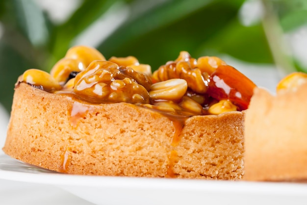 Nut tartlets covered with a layer of sugar caramel