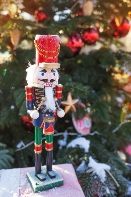 Nutcracker at Christmas Market  in Winter Moscow, Russia. Advent Decoration and fir tree with Crafts gifts on the Bazaar. Street Xmas holiday in Europa. Christmas decoration on city street