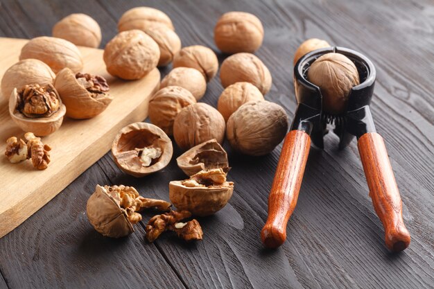 Nutcracker and walnuts on a wooden background