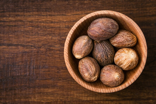 Nutmeg closeup on wood