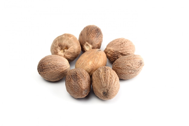 Nutmeg isolated on white background. Close up.