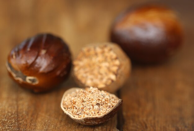 Nutmeg or Jaifal Spice on wooden surface