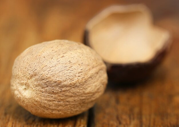 Nutmeg or Jaifal Spice on wooden surface