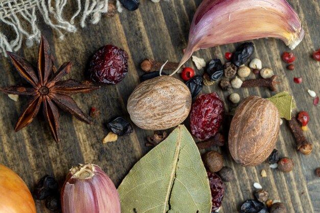 Nutmeg and other spices mixed on the table whole nutmeg spice and other spices with a pleasant aroma