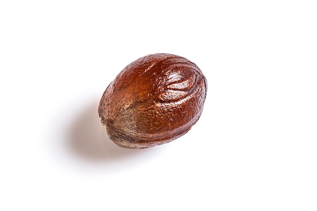 Nutmeg spice on a white background. Top view. Still life. Copy space. Flat lay