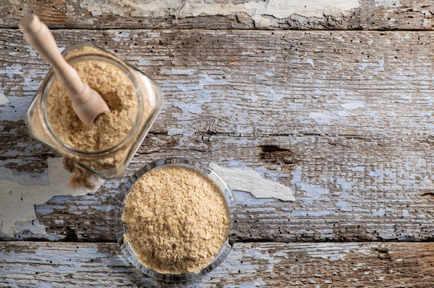 Photo nutritional yeast in flakes, deactivated in glass bowls