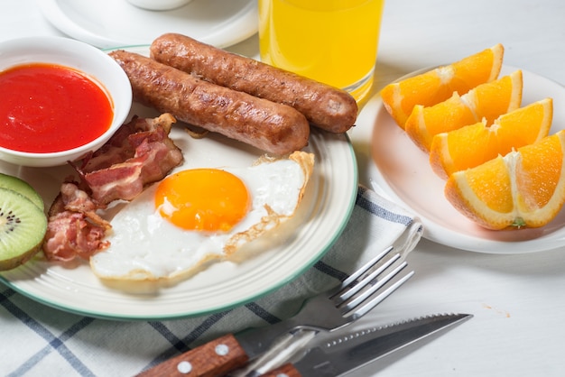 Nutritious breakfast, strawberry, bread, coffee orange juice, sausage, egg