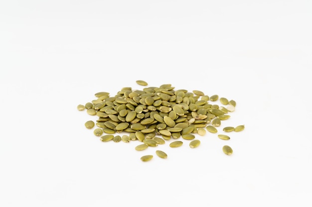 Nutritious nut pumpkin seeds on white background