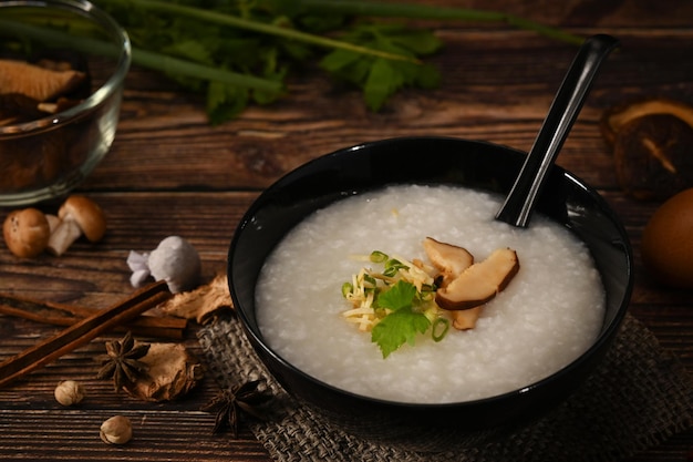 Nutritious rice porridge with soft boiled egg shiitake mushroom slice ginger and slice scallion for light meal