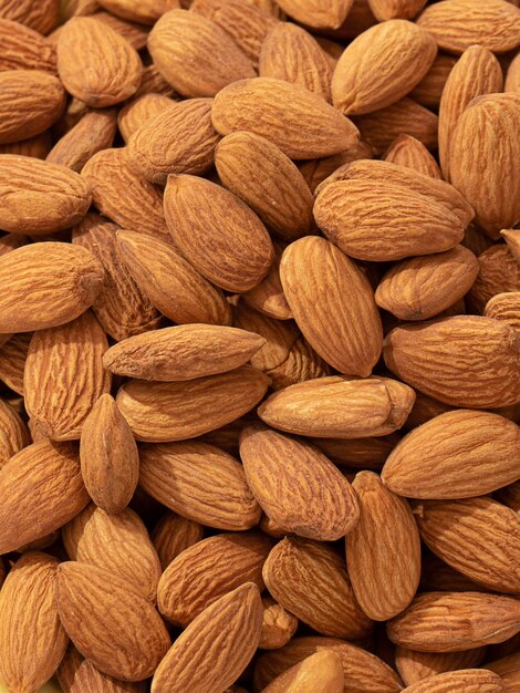 Nuts background closeup close photo of almond nuts vertical photo