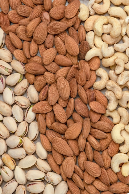 Nuts background, top view. The natural background is made from different varieties of nuts.