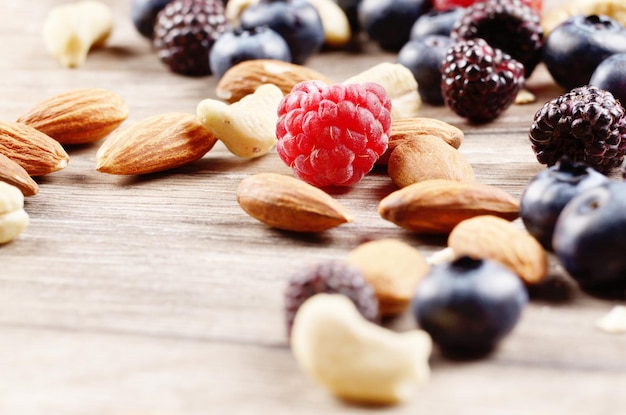 Nuts and berries on the wooden table