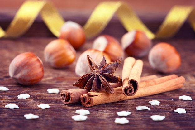 Nuts and cinnamon on table