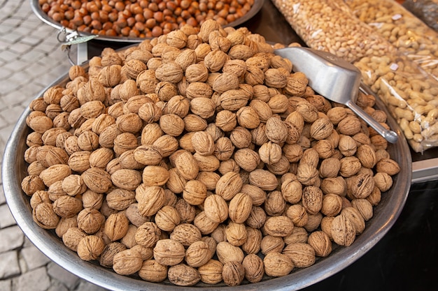 Nuts on a large platter on sale. Market for Eastern sweets. variety of nut varieties on the market