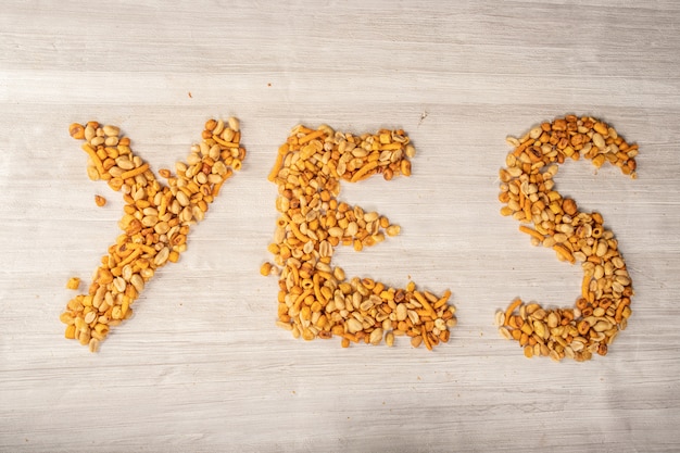 Nuts making words of yes or no, snack for between hours