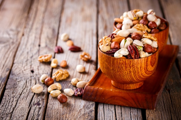 Nuts Mixed in a wooden plate.