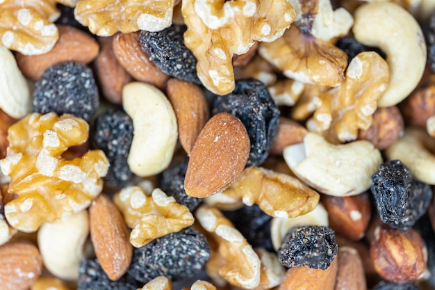 Nuts stacked with hazelnuts cashews and raisins in a macro photograph shot