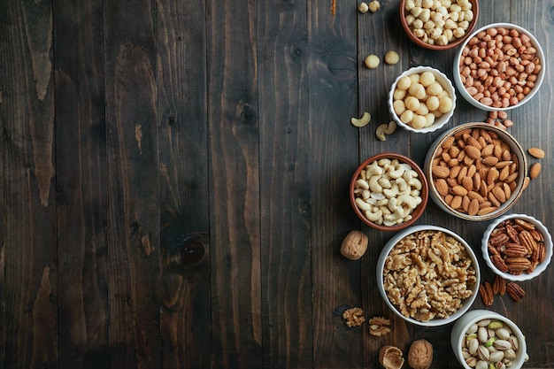 Nuts variety in the bowls cashew hazelnut macadamia pistachio almond walnut peanut pecan