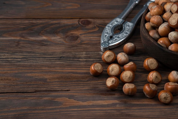 Nuts in wood bowl wooden backround